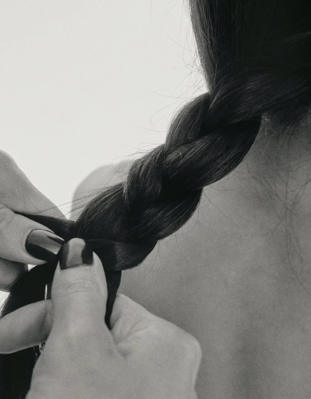 Hands braiding hair that's gentle on skin