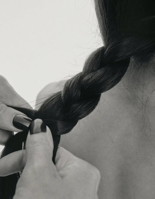 Hands braiding hair that's gentle on skin